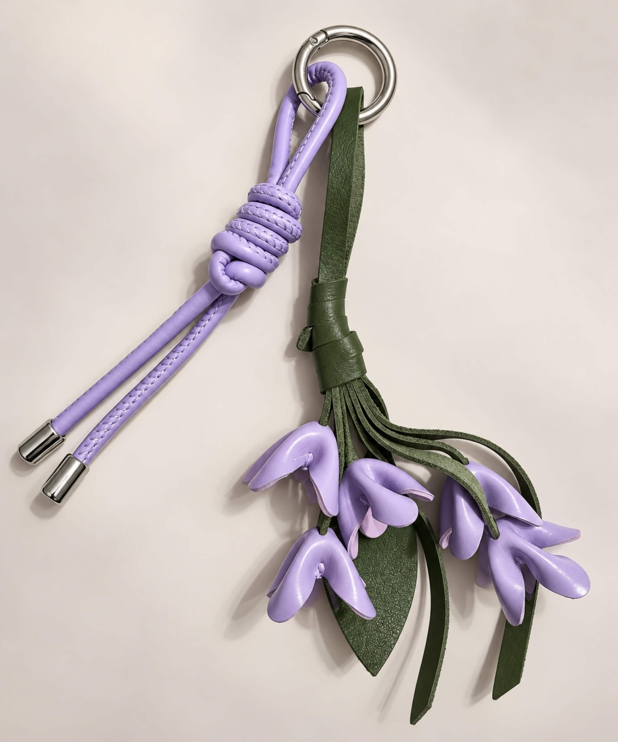 Purple floral PU leather bag charm keychain with green leaves and knotted cord