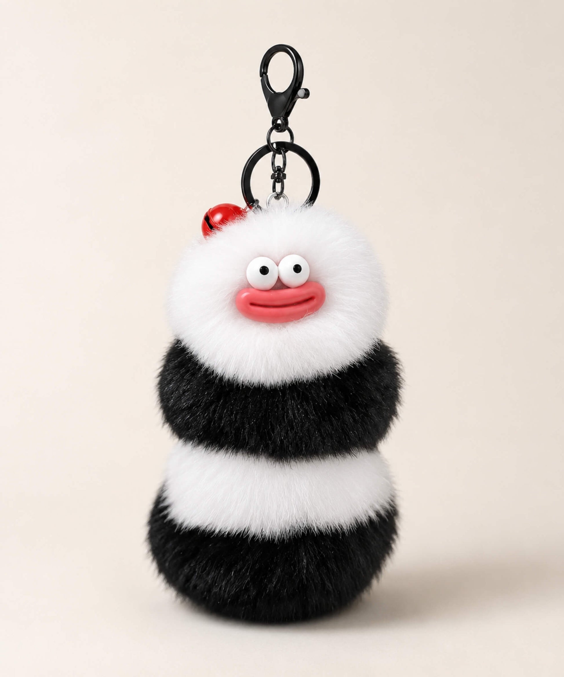 Black and white fluffy caterpillar plush keychain with red mouth detail
