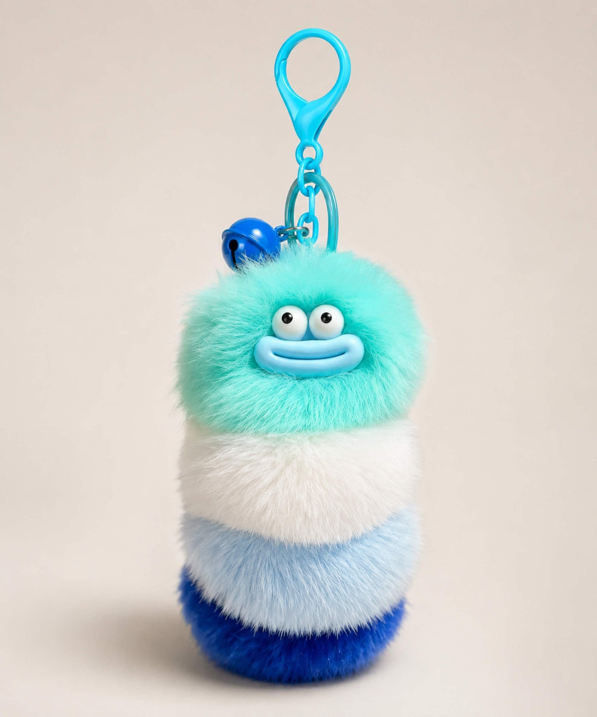 Blue fluffy caterpillar plush keychain with aqua, white, light blue and deep blue layers