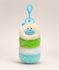 Cream fluffy caterpillar plush keychain with cream, green, white and aqua layers