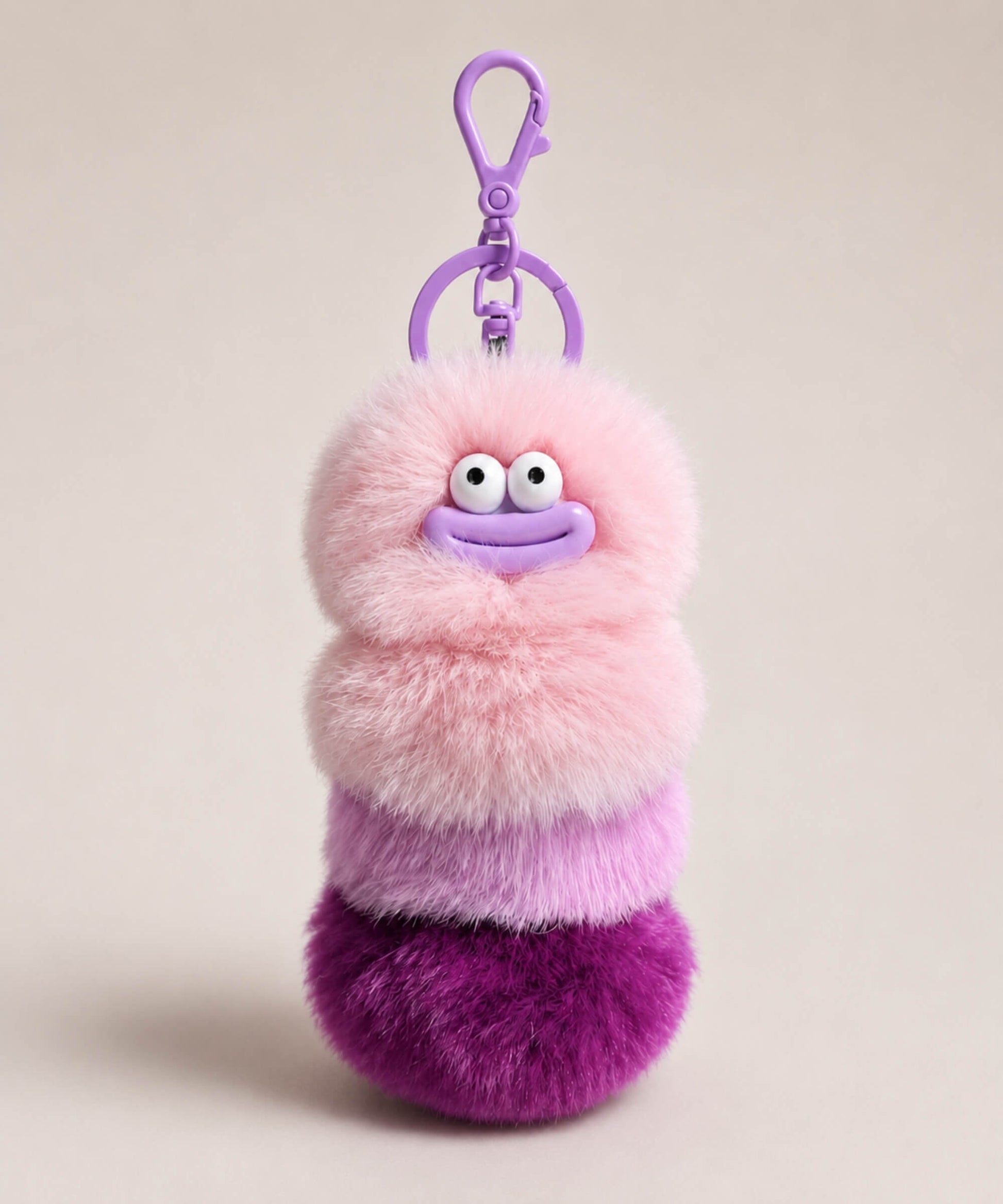 Purple fluffy caterpillar plush keychain with pink and purple layers, cute face and purple clip