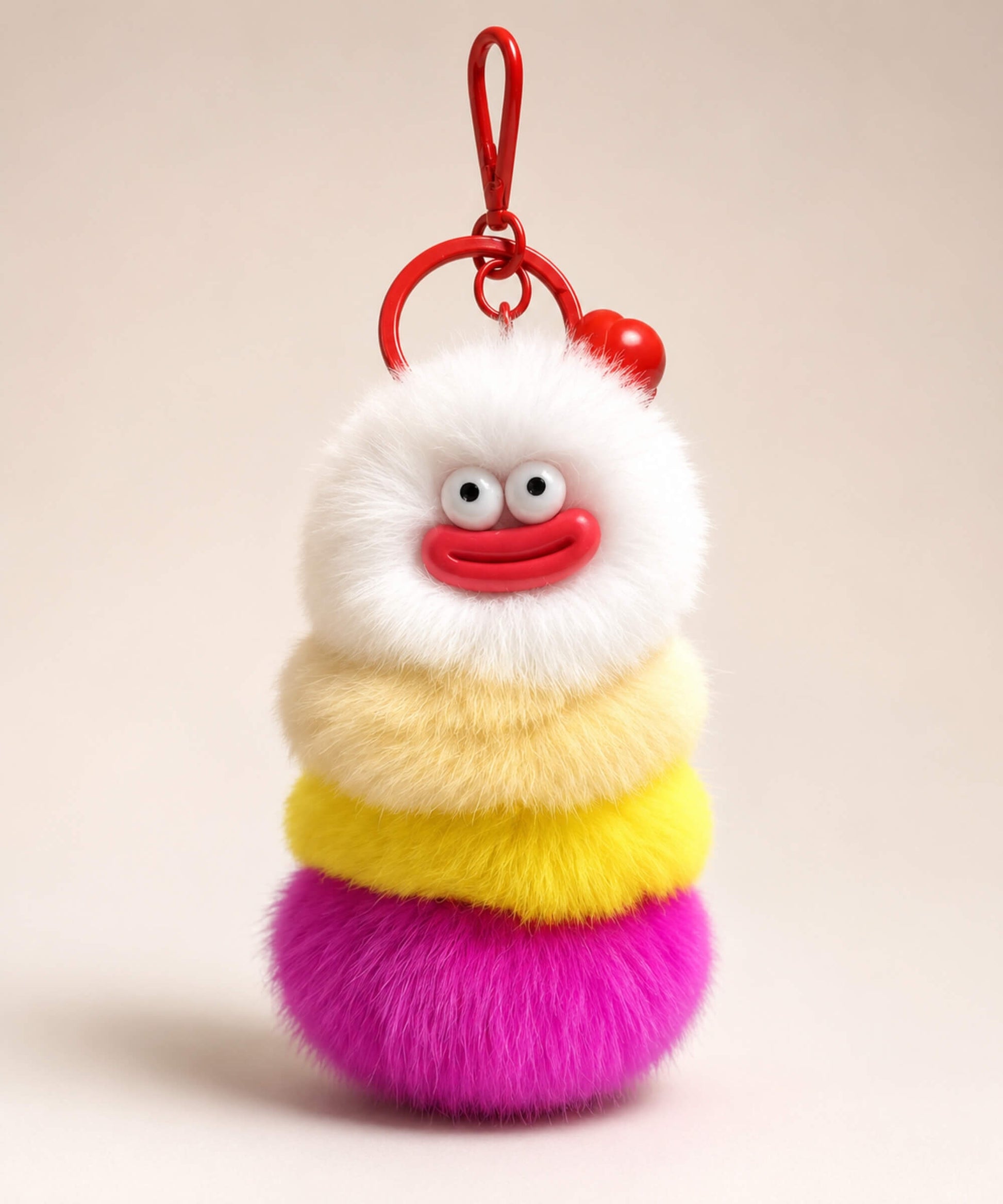 Rose pink fluffy caterpillar plush keychain with cream, yellow, orange and rose pink layers