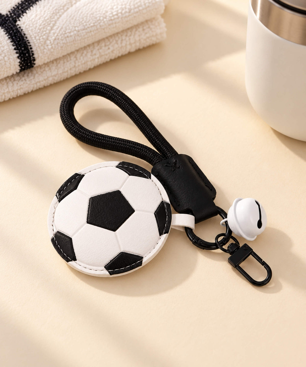 Football PU leather-look bag charm keychain with black wrist strap