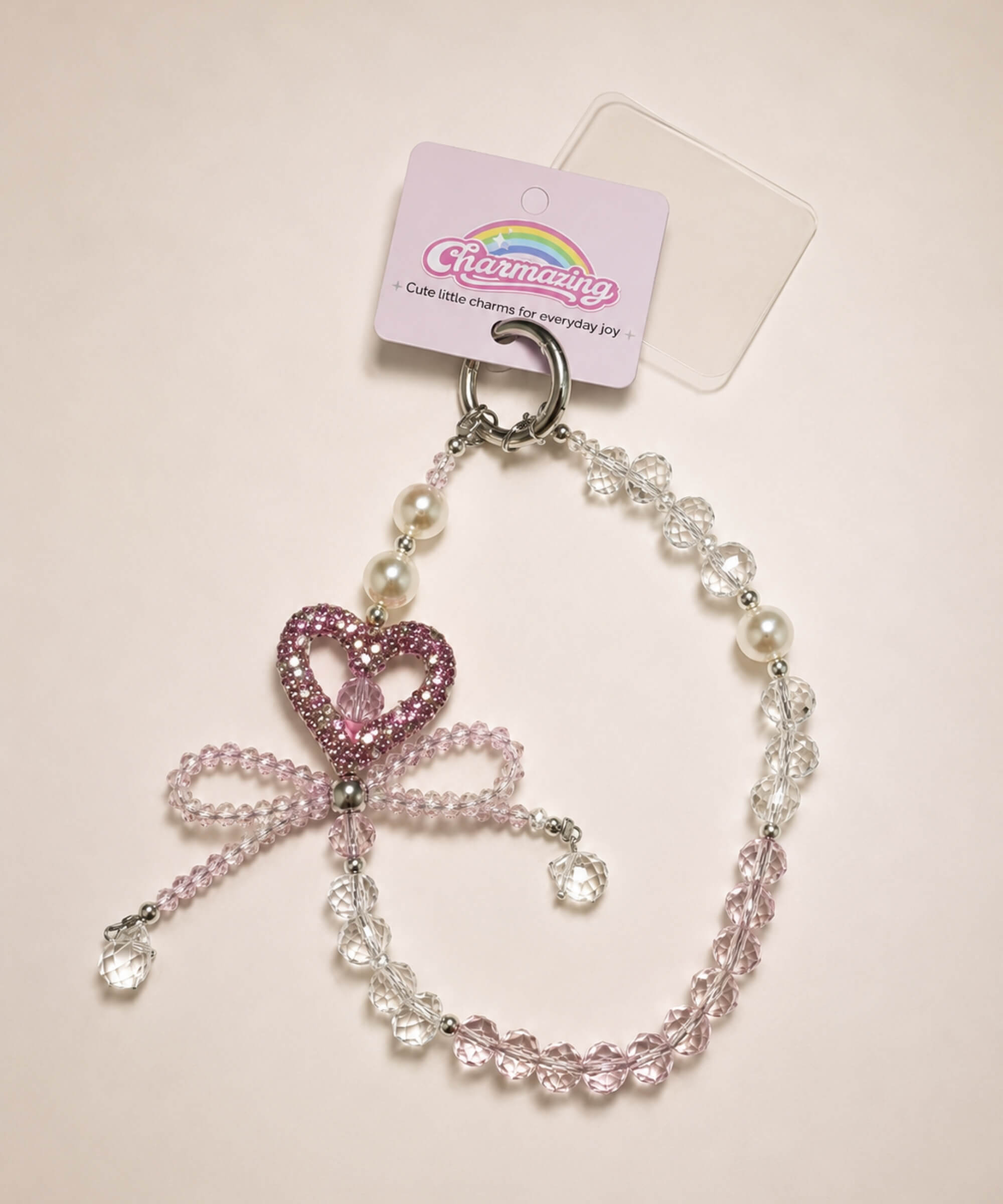 Pink heart bow beaded phone charm with crystal-style beads and sparkling heart detail