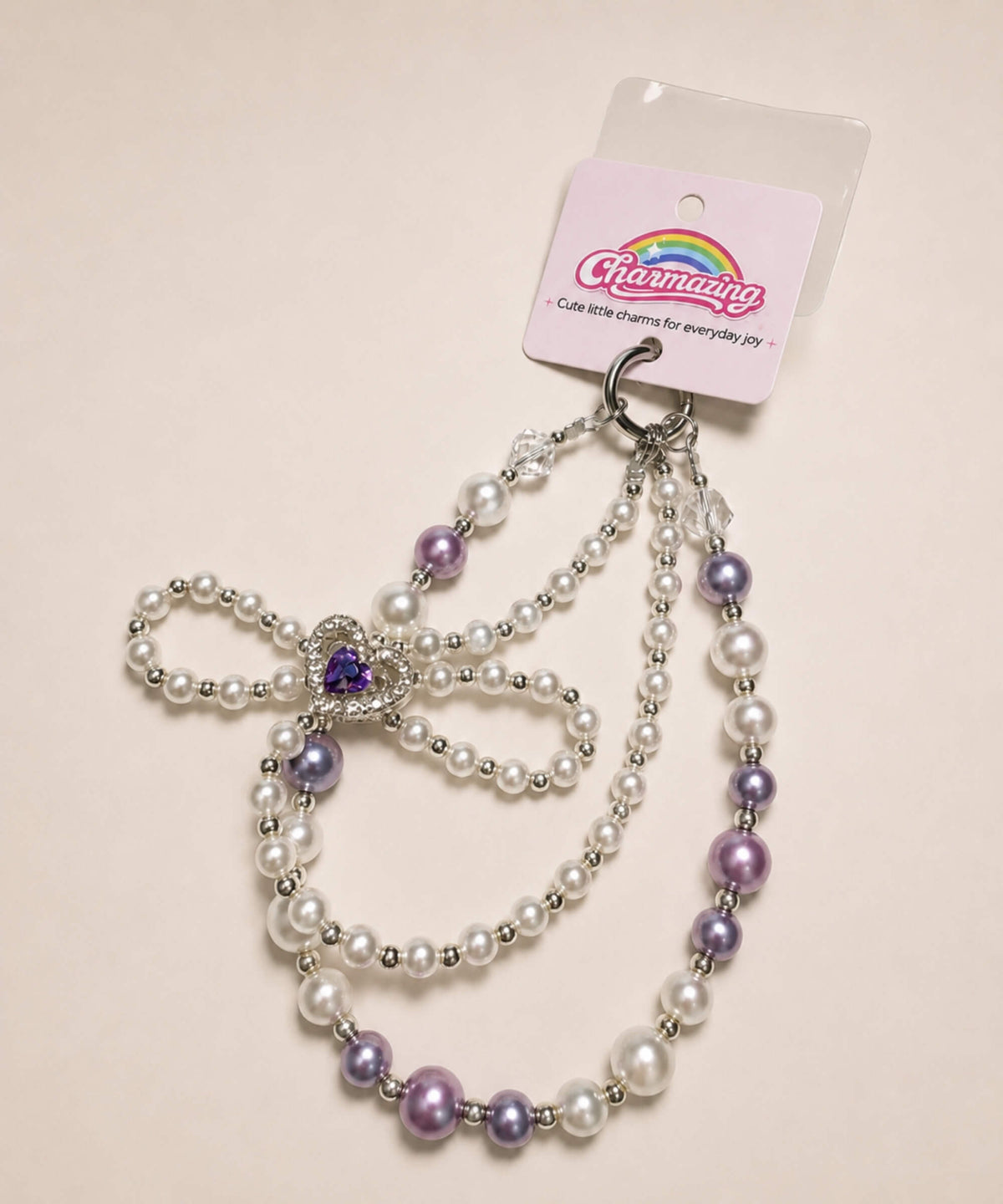 Purple heart bow beaded phone charm with pearl-look beads and sparkling heart centrepiece