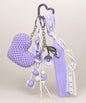 Purple heart crochet keychain with lace ribbon and decorative charms