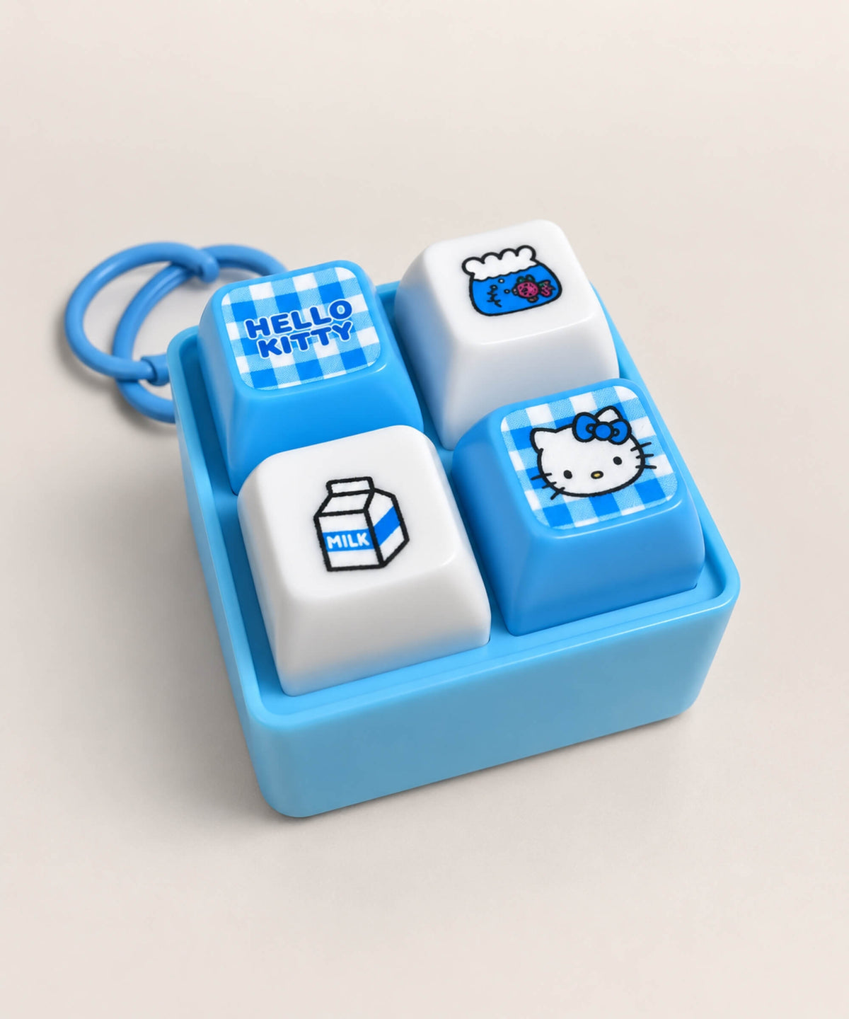 Blue Hello Kitty light up sound button keychain shown from an angled view with four interactive buttons