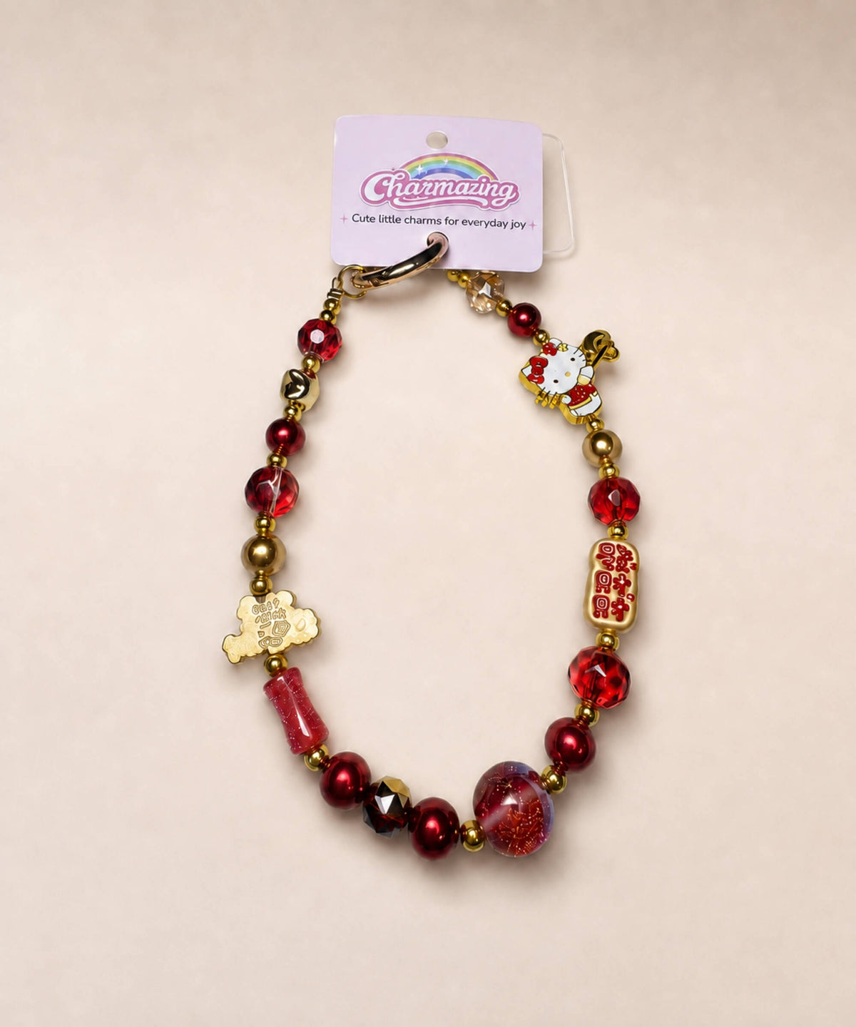 Hello Kitty lucky charm beaded phone charm in Fa Cai style with red beads and gold-tone details