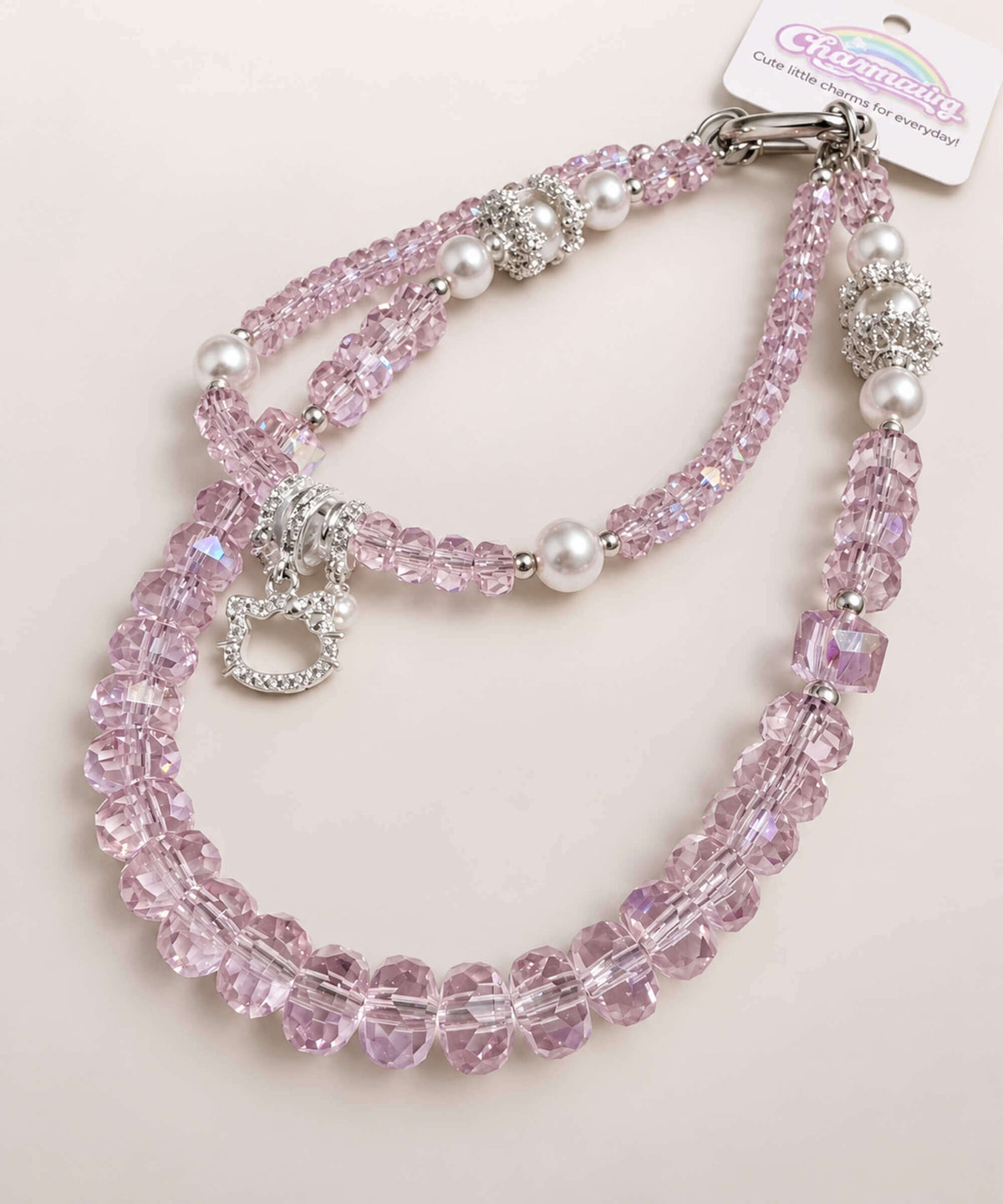 Hello Kitty pearl heart beaded phone charm with pink crystal-style beads, pearl accents and a delicate heart charm