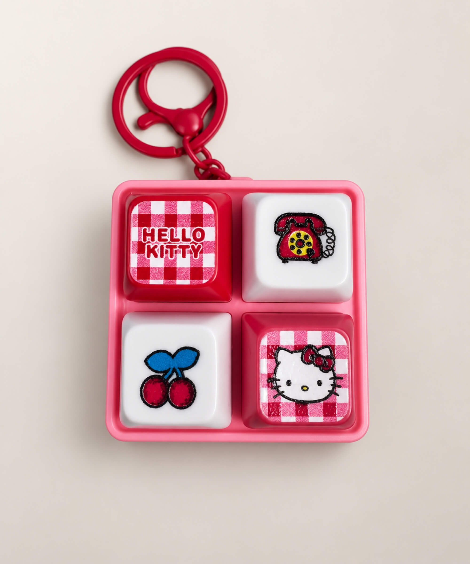 Red Hello Kitty light up sound button keychain with cherry and telephone button designs