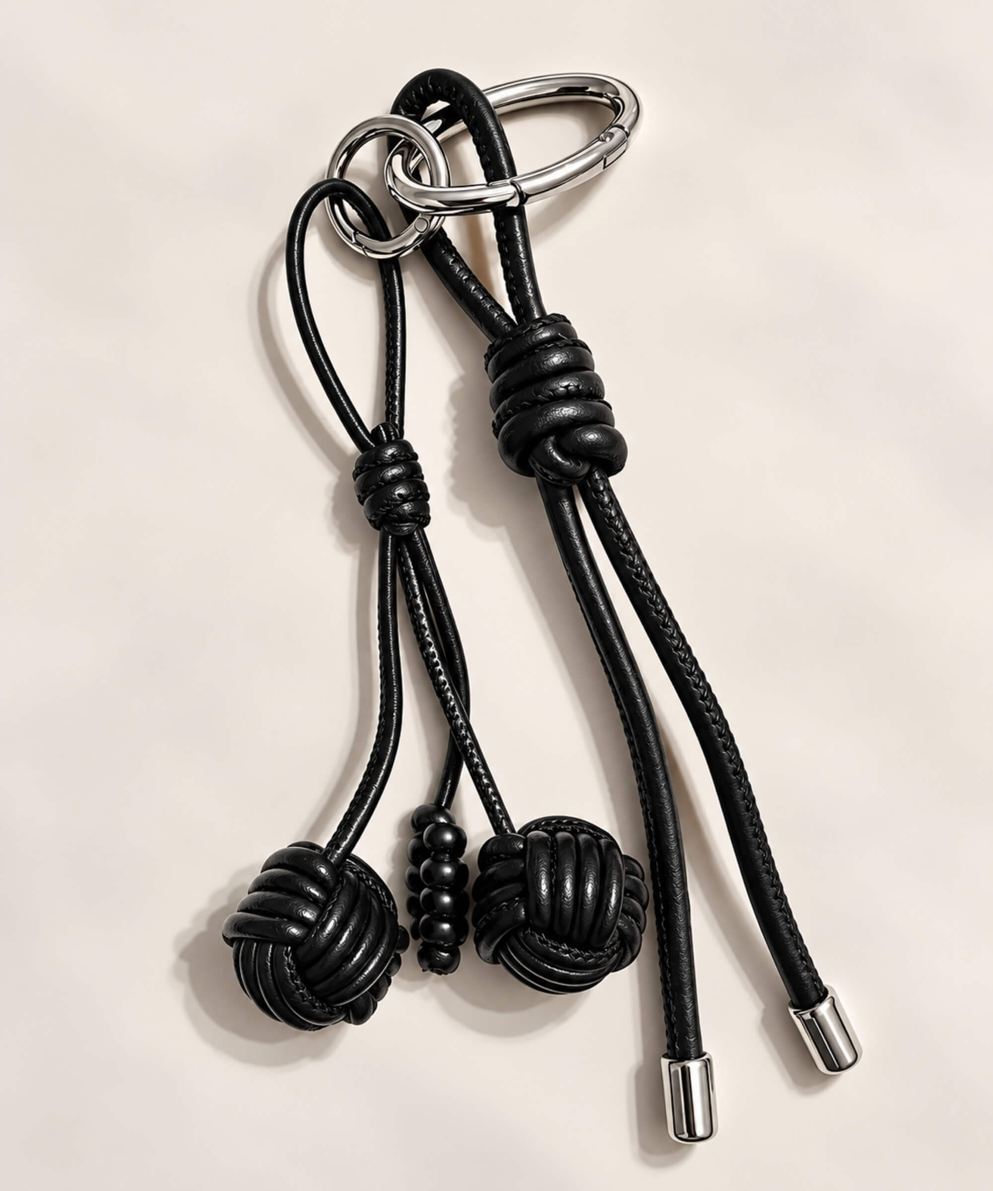 Black knotted ball PU leather bag charm keychain with double ball cord details