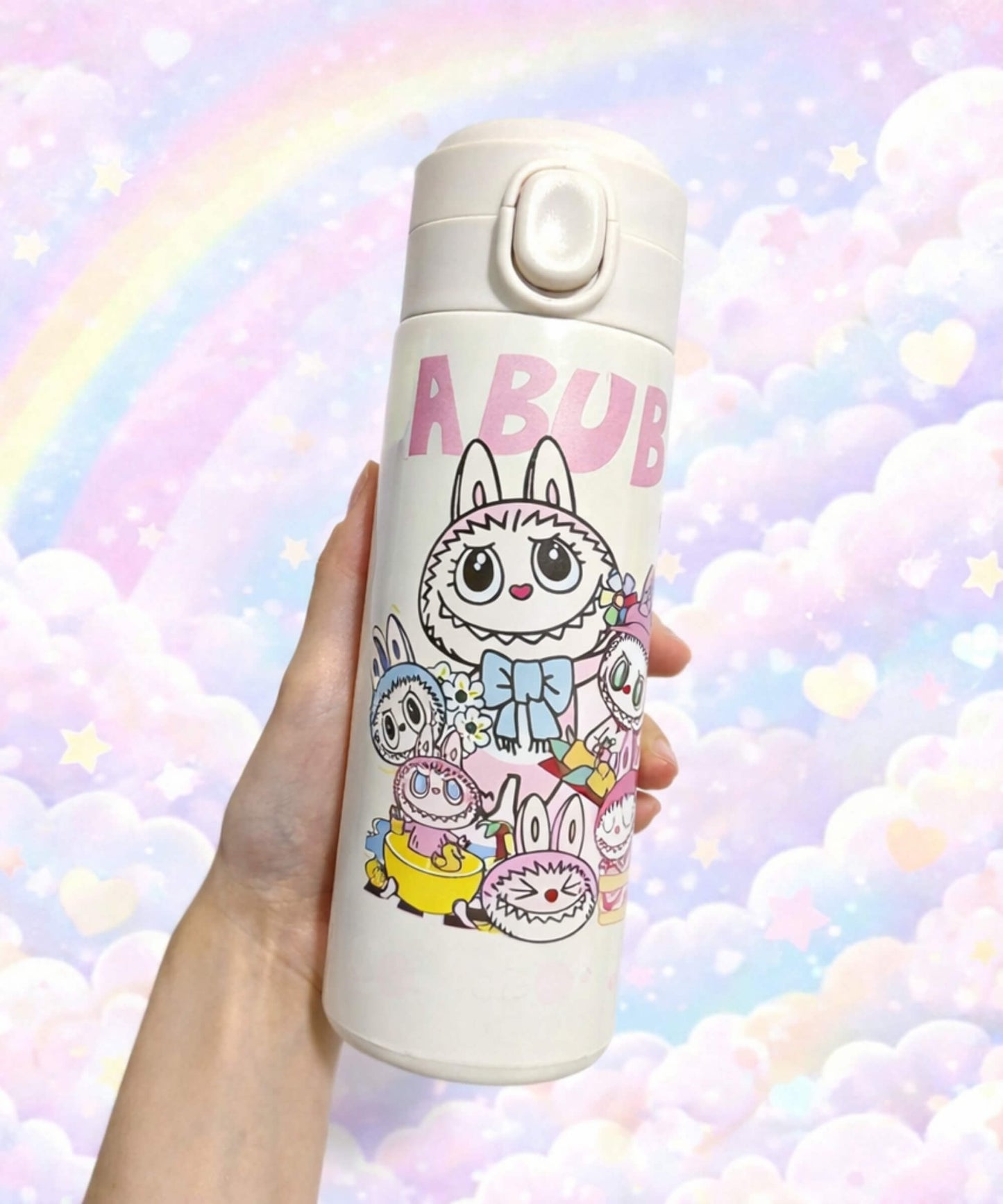 Labubu style insulated water bottle with multiple cartoon characters design held in hand, 420ml stainless steel thermal bottle with pastel background
