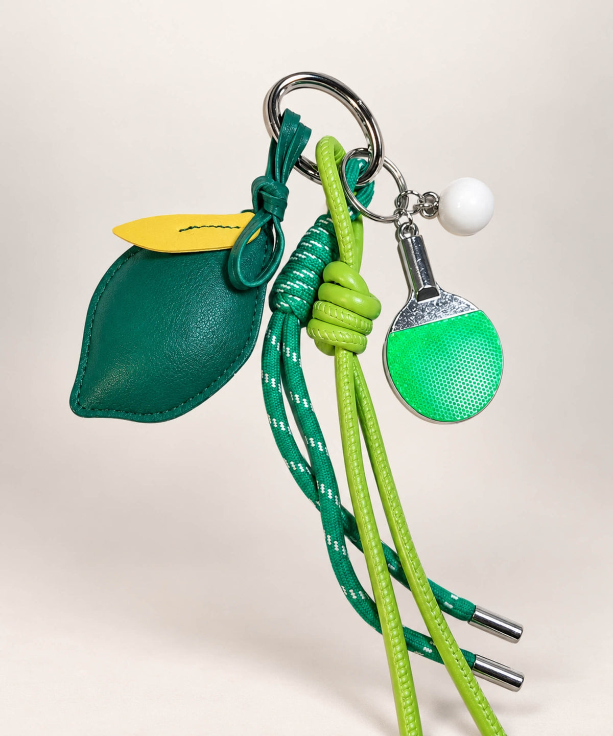 Green lemon table tennis PU leather bag charm keychain with mini paddle and rope details