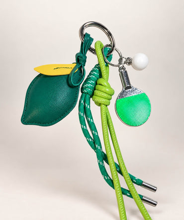 Green lemon table tennis PU leather bag charm keychain with mini paddle and rope details