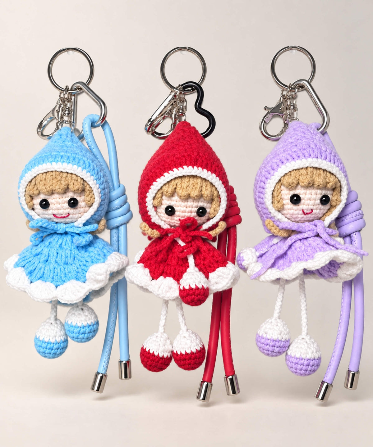 Little Red Riding Hood style crochet keychains in blue red and purple
