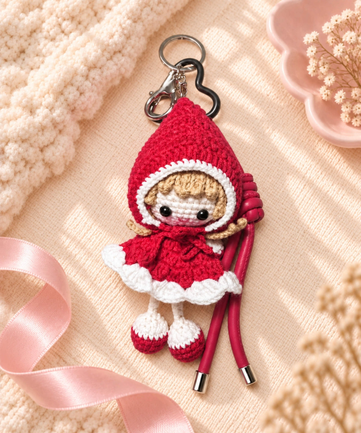 Little Red Riding Hood style crochet keychain in red with matching hanging cords