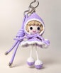 Purple Little Red Riding Hood style crochet doll keychain with hooded cape