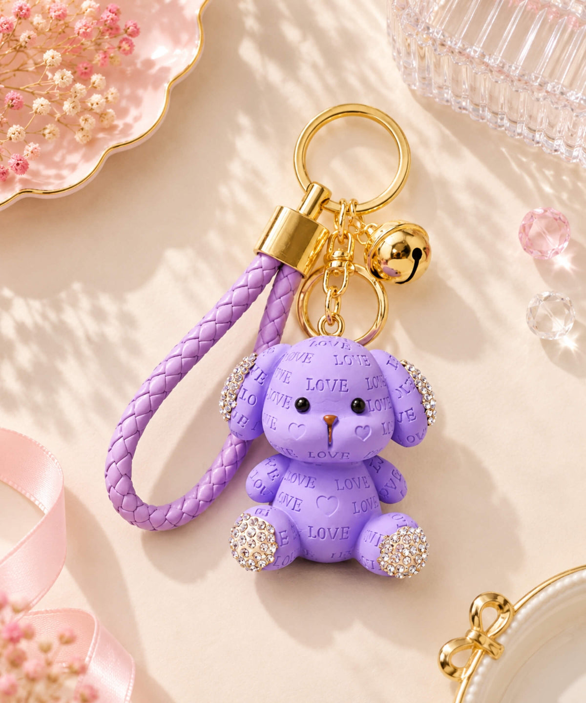 Purple Love puppy resin keychain with rhinestone ears and paws, braided strap, bell and gold-tone hardware