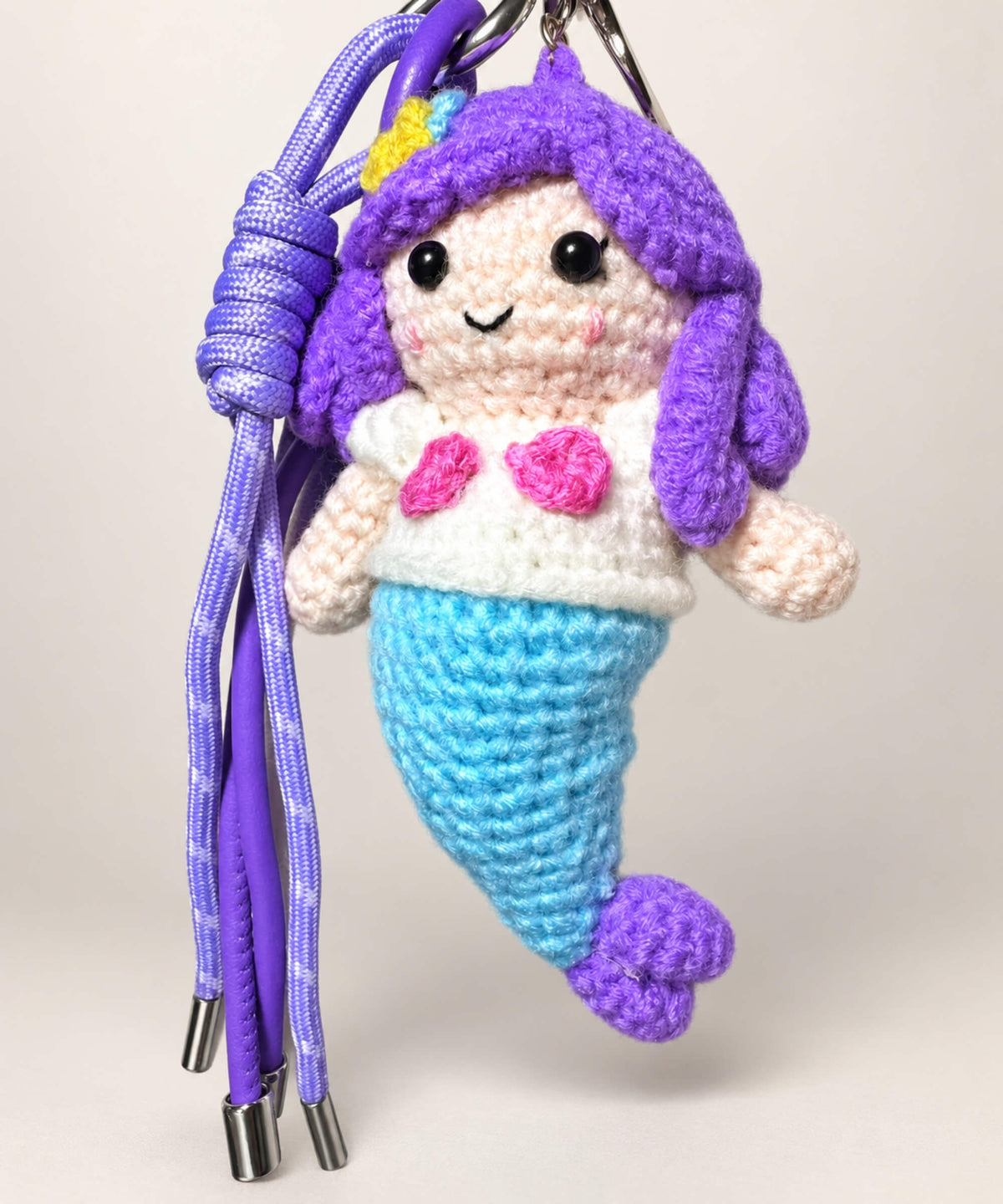 Colourful mermaid crochet keychain with purple hair and blue tail