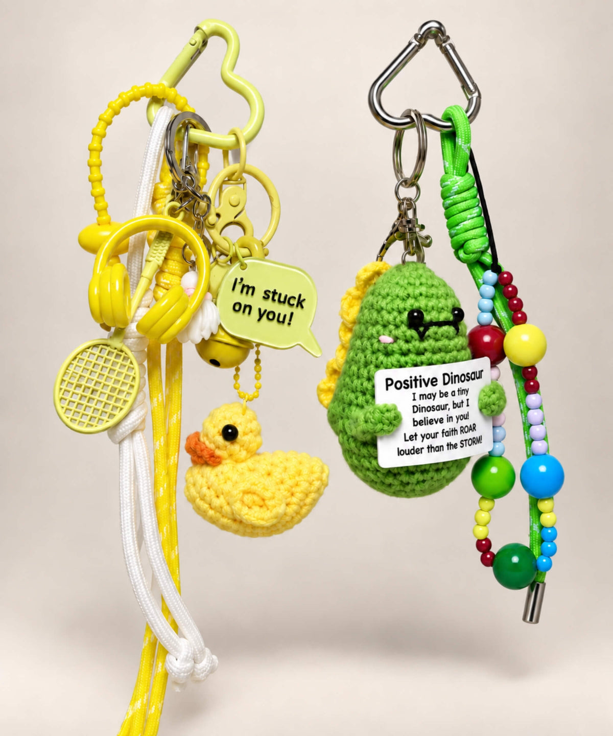 Stuck on You Duck and Positive Dinosaur crochet keychains with colourful charms and cords