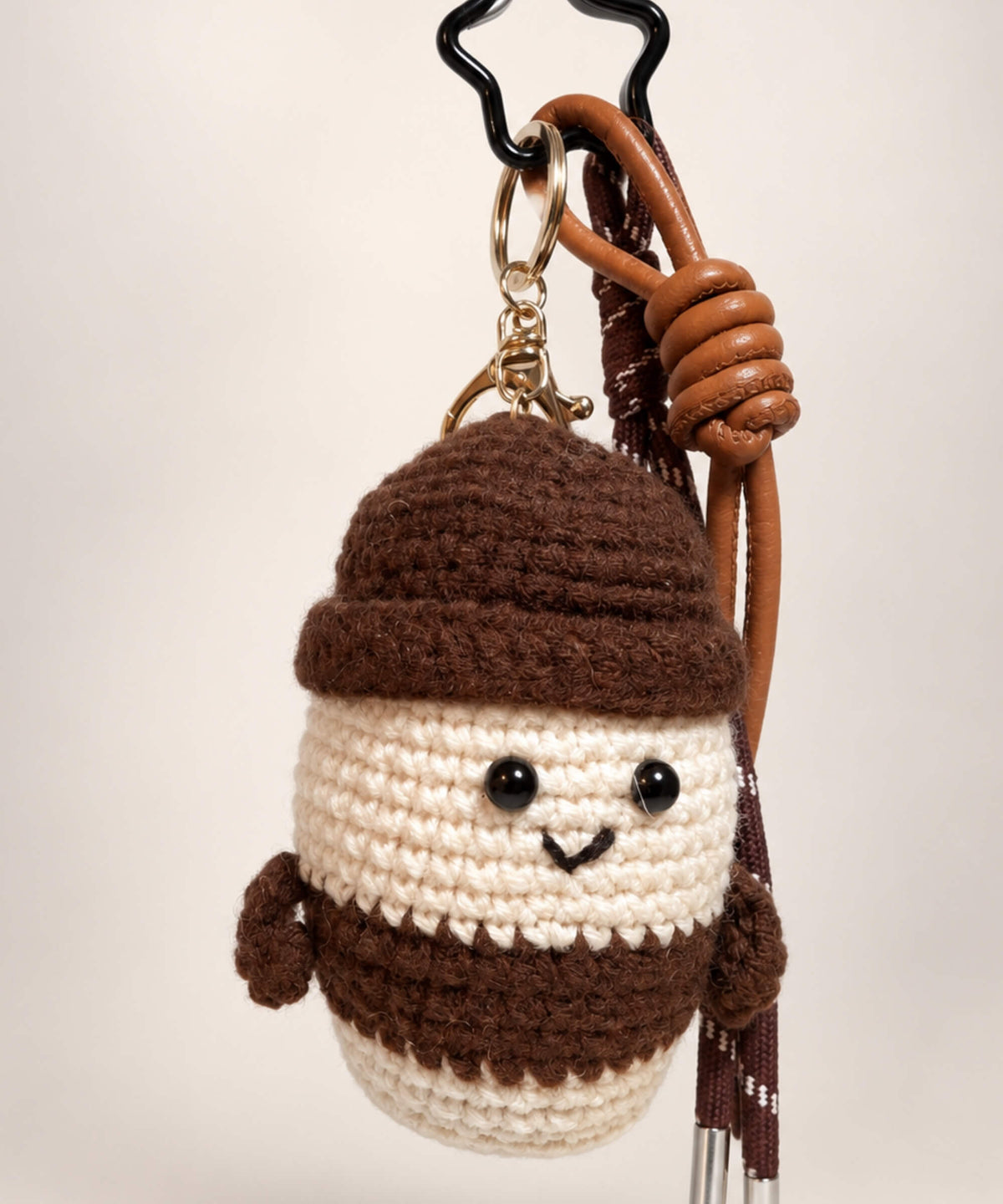 Brown and cream milk tea cup crochet keychain with hanging cords and metal bag charm hardware