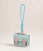 Blue mini PU leather earphone pouch keychain with wrist strap on a neutral background