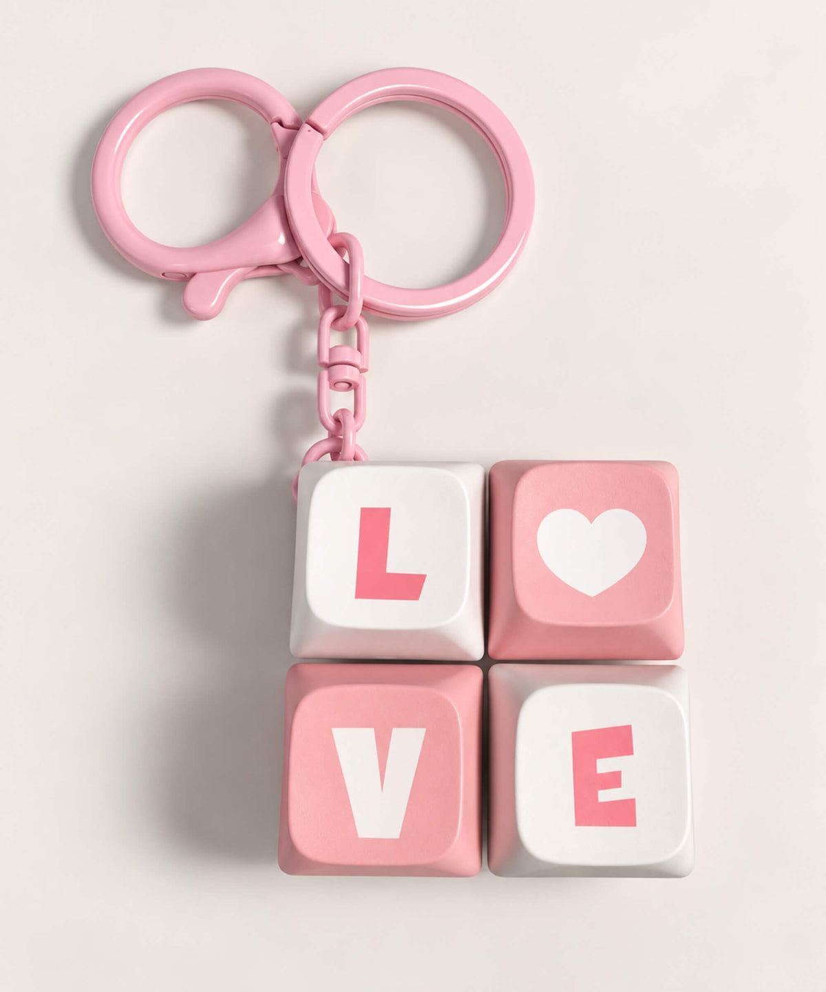 Pink Love mini keyboard fidget keychain with four pressable keys