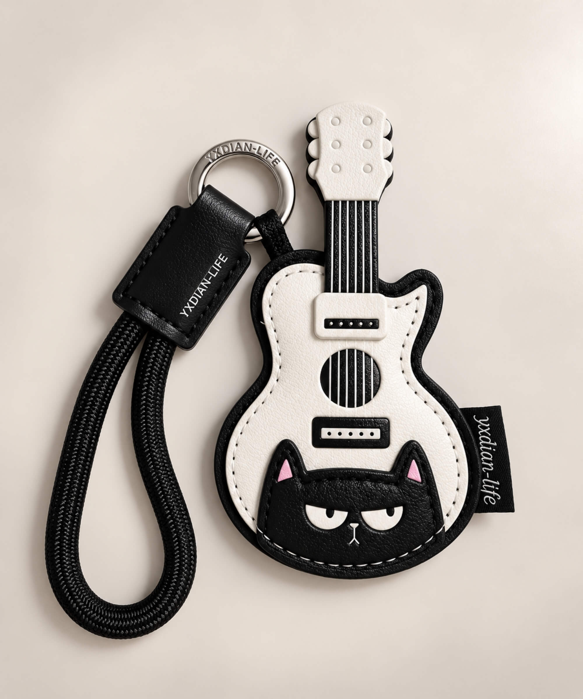 Black and white guitar PU leather bag charm keychain with black cat detail and black wrist loop