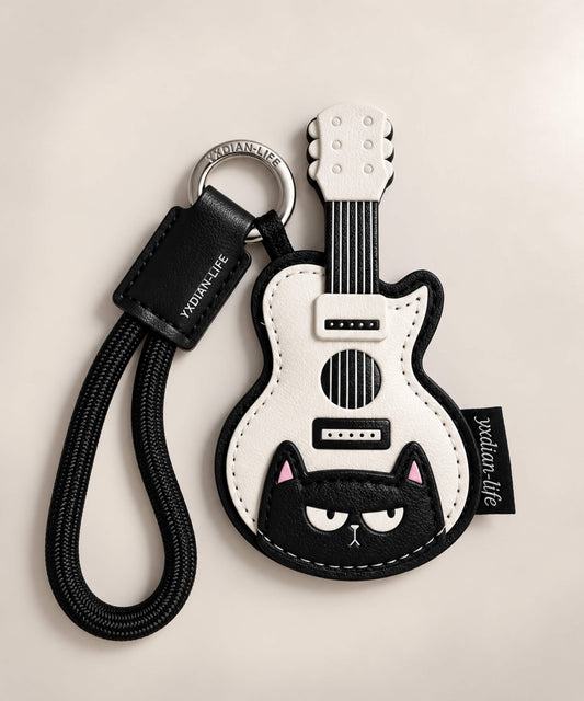 Black and white guitar PU leather bag charm keychain with black cat detail and black wrist loop