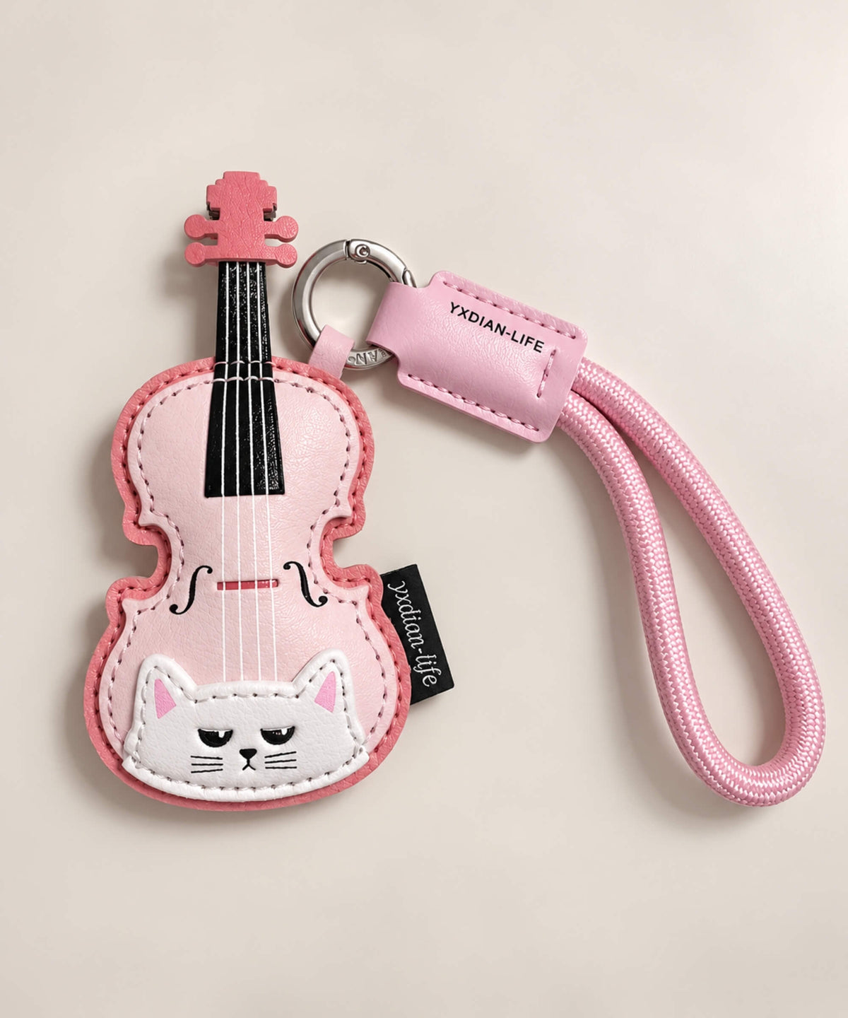 Pink violin PU leather bag charm keychain with white cat detail and pink wrist loop