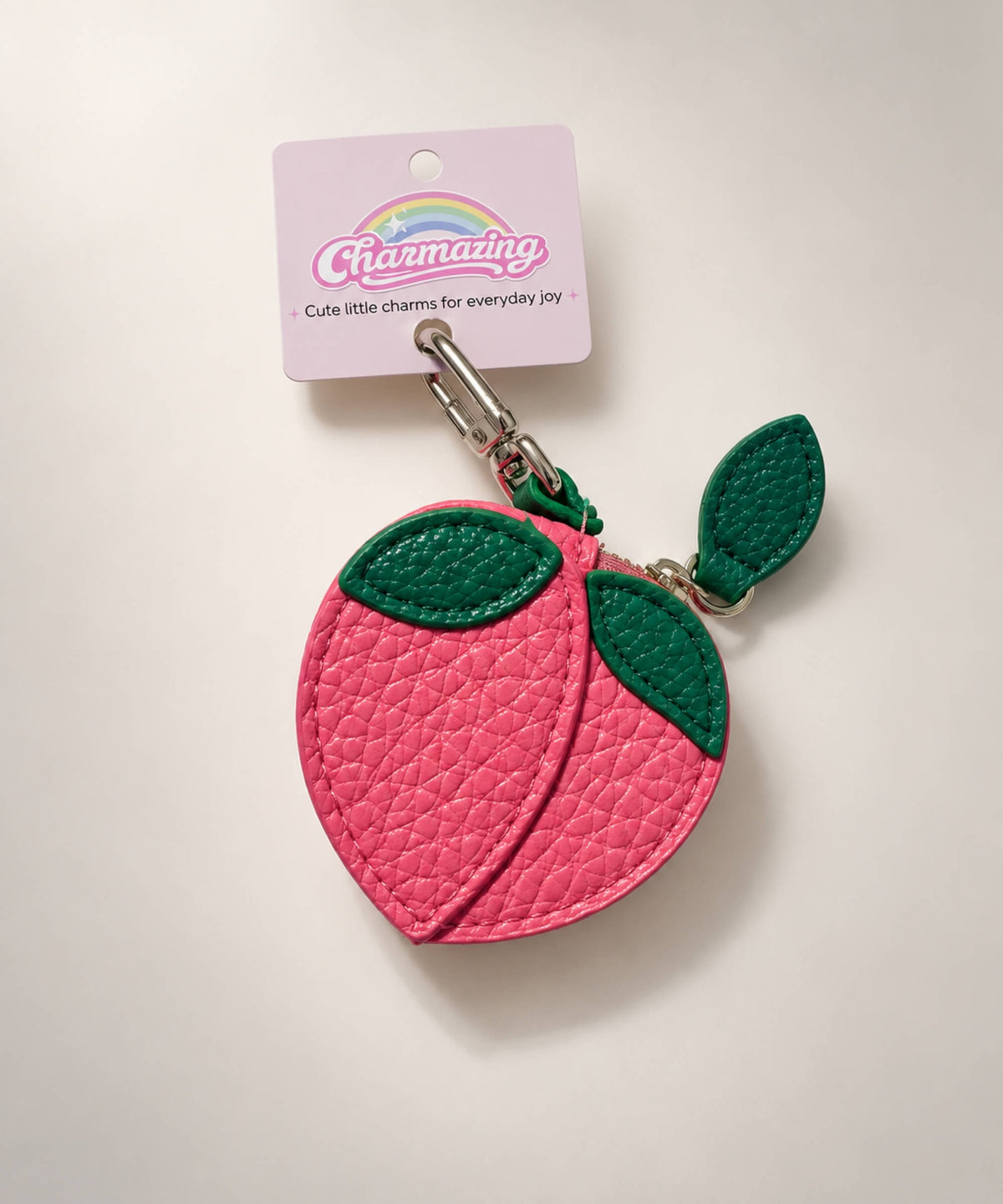 Peach fruit coin purse keychain with pink PU leather-style pouch and green leaf details