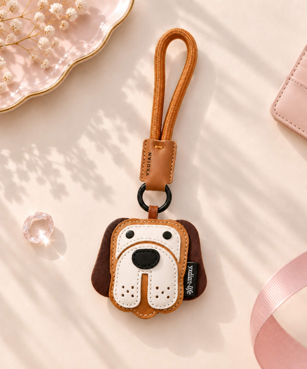 Brown dog face PU leather bag charm keychain with white muzzle detail and matching wrist strap