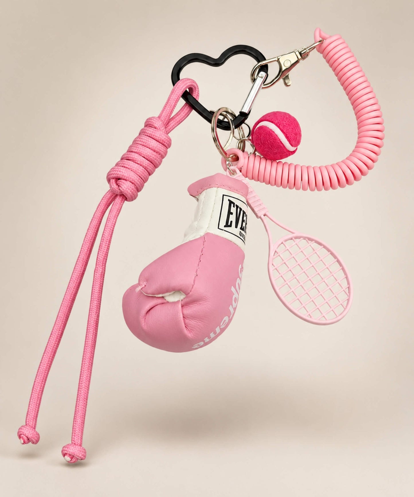 Pink boxing glove and tennis rope keychain with tennis racket and tennis ball charm