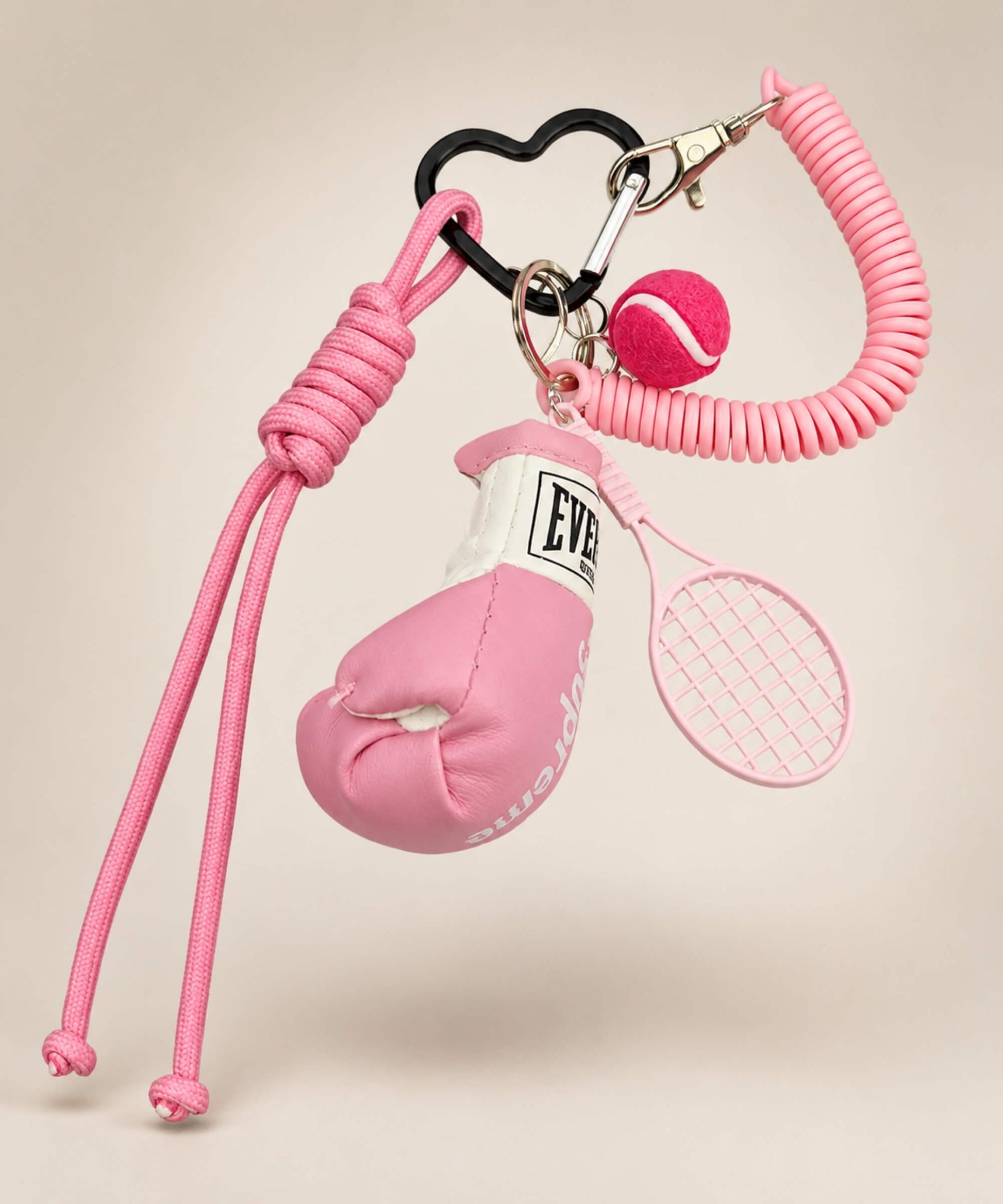 Pink boxing glove and tennis rope keychain with tennis racket and tennis ball charm