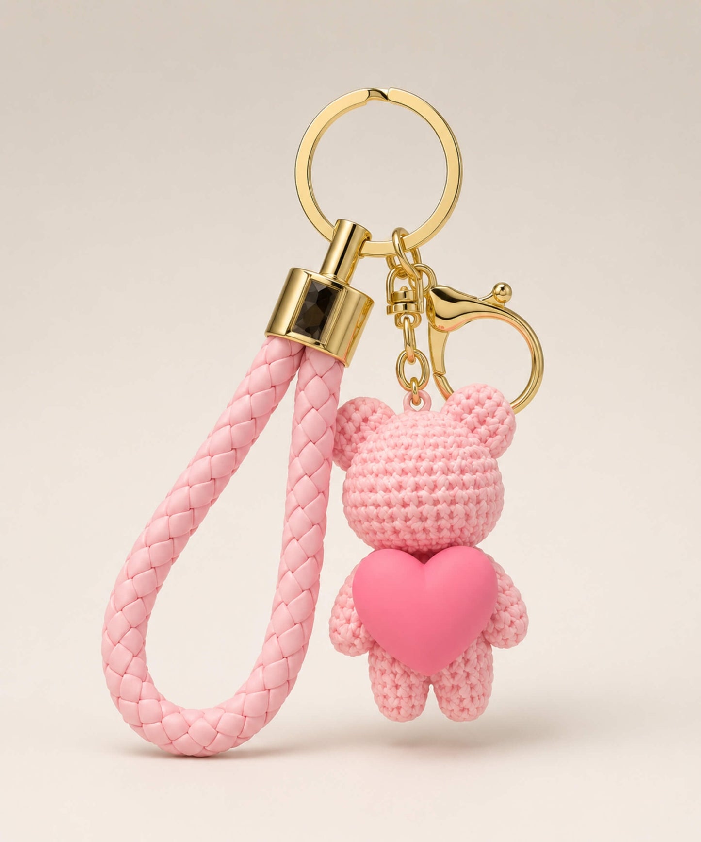 Pink knitted-look heart bear resin keychain with braided wrist strap and gold hardware
