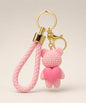 Pink knitted-look heart bear resin keychain with braided wrist strap and gold hardware