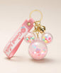Pink Mickey head floating shaker keychain with pastel beads and gold bell