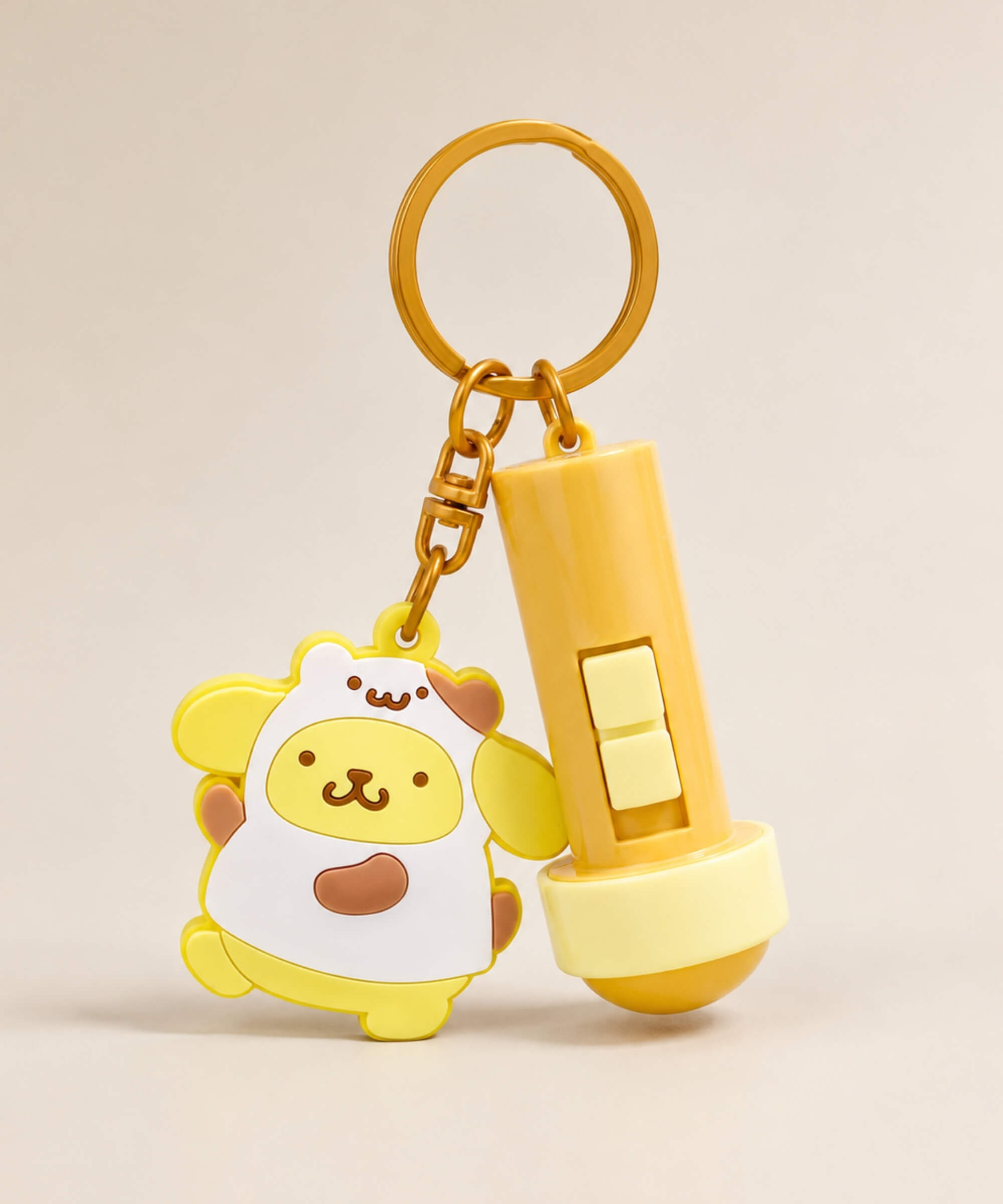 Pompompurin projection light interactive keychain with yellow charm and gold hardware