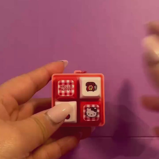 Hello Kitty light up sound button keychain with interactive buttons shown in use