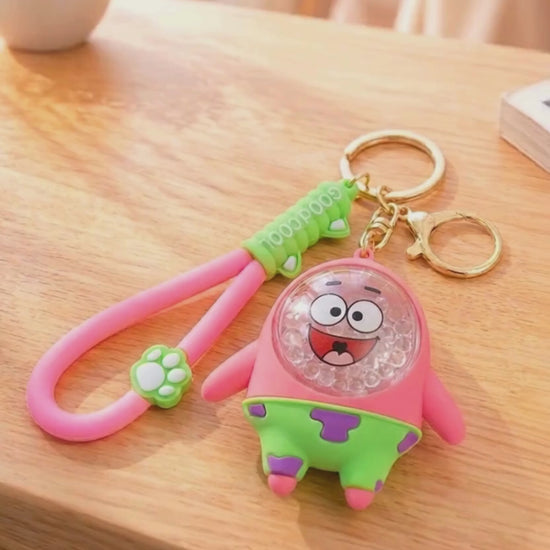Bubble bead keychain with moving shaker beads inside charm