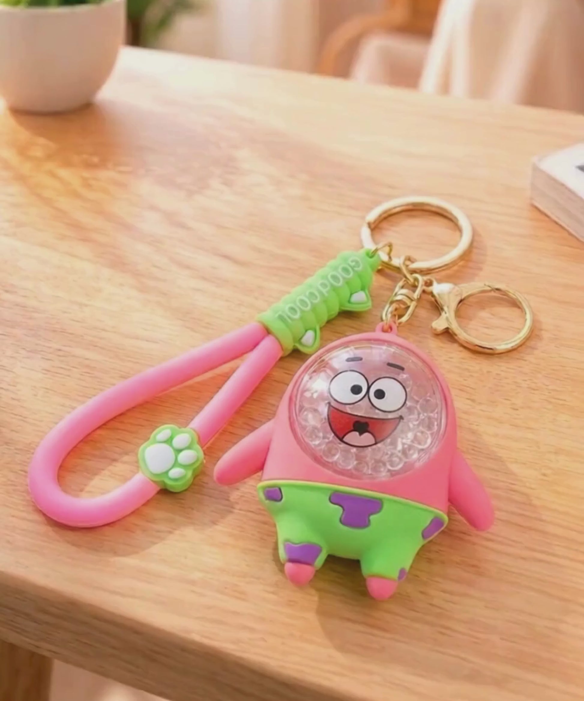Bubble bead keychain with moving shaker beads inside charm