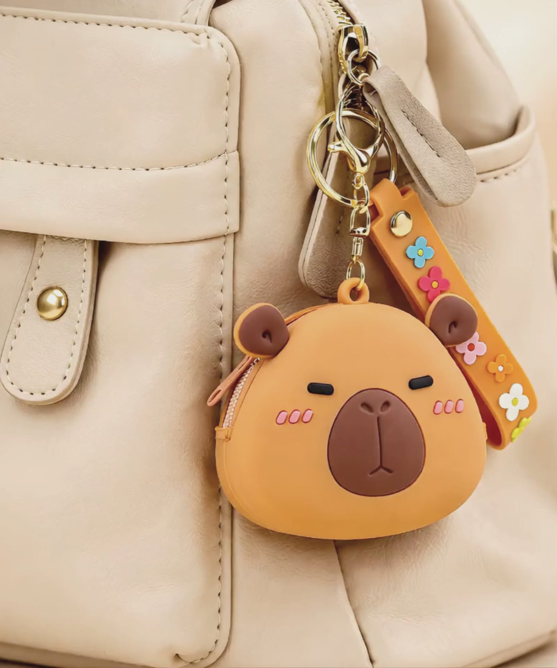 Capybara silicone coin purse keychain hanging on backpack, cute mini wallet bag charm in everyday use