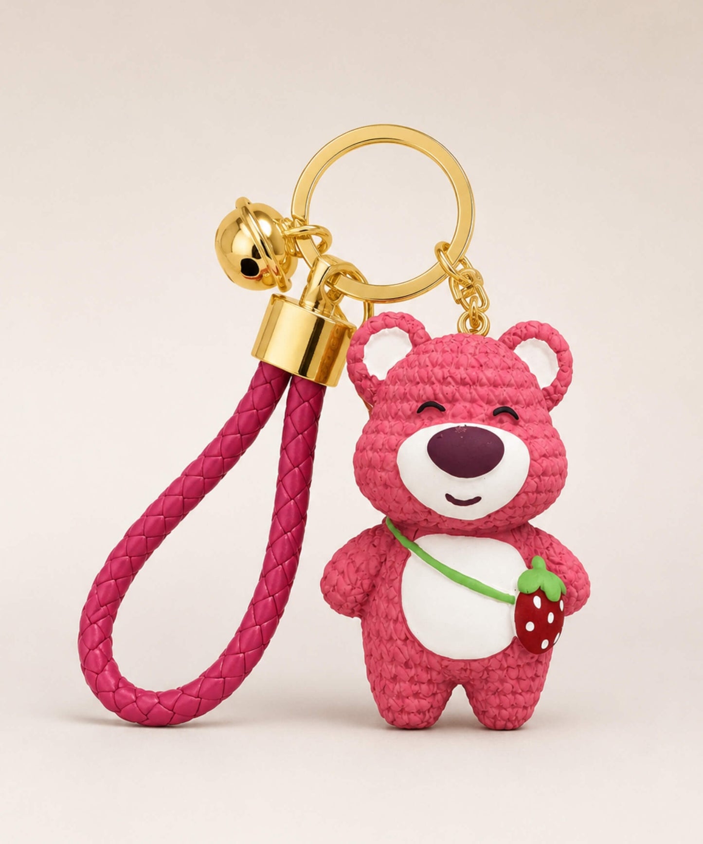 Rose pink strawberry bear resin keychain with strawberry detail, braided wrist strap and gold hardware