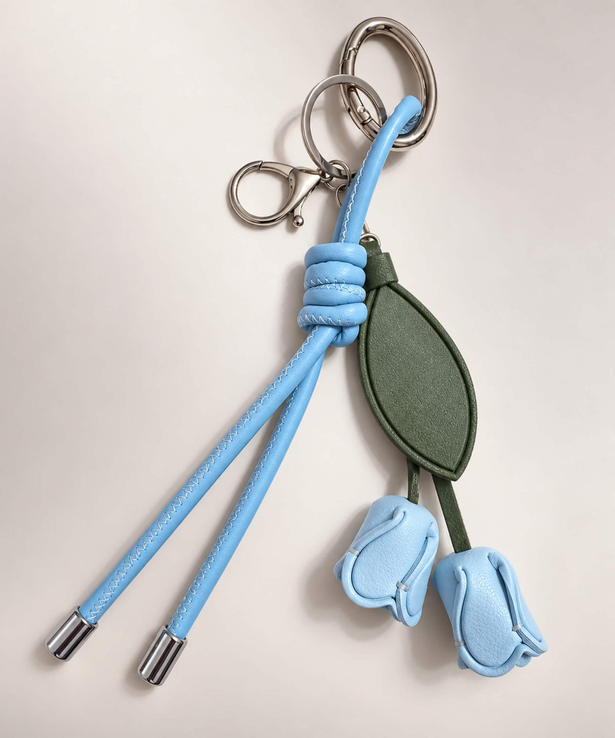 Blue rose PU leather bag charm keychain with green leaves and knotted cord