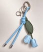 Blue rose PU leather bag charm keychain with green leaves and knotted cord