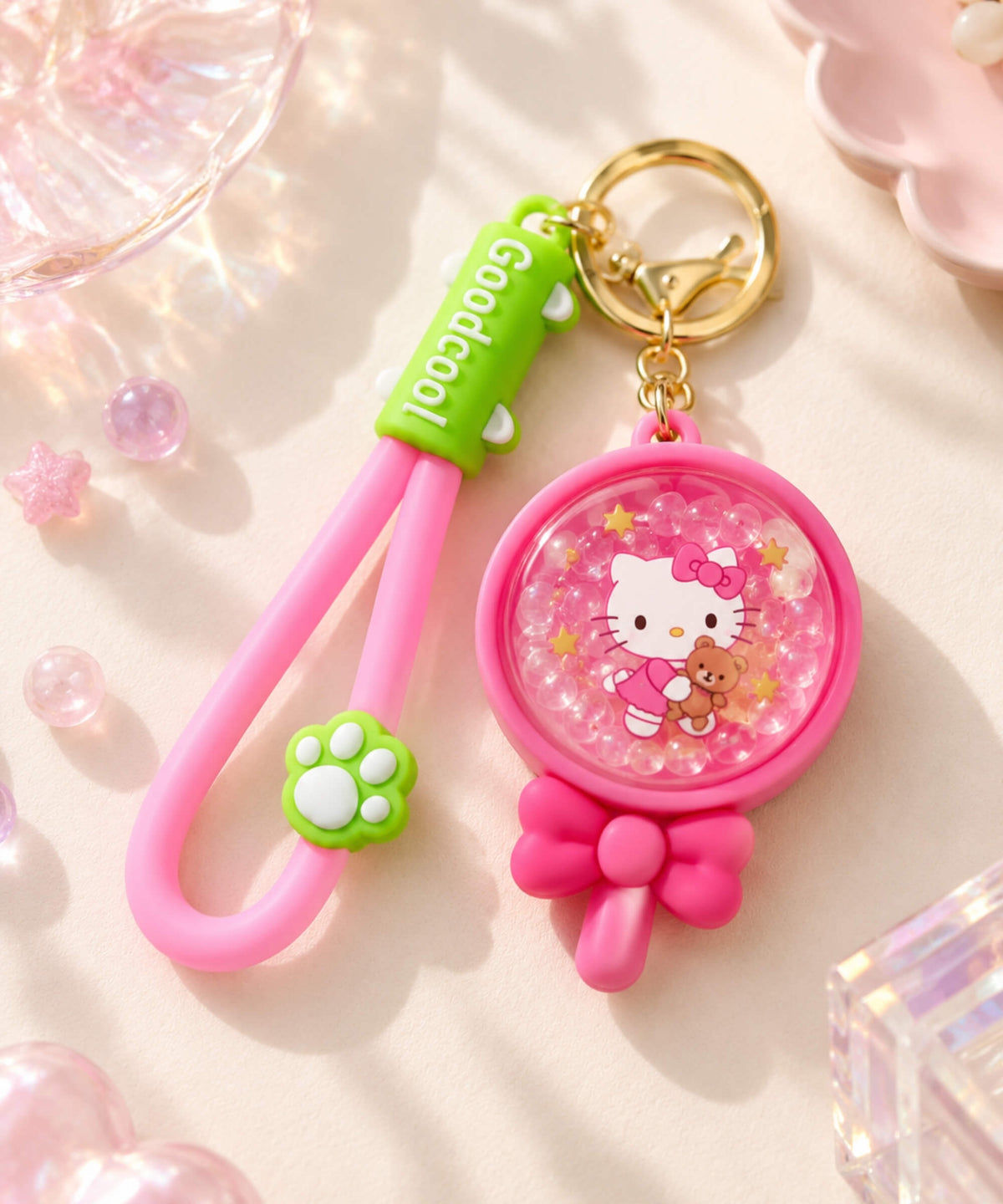 Hello Kitty bead shaker keychain with pink lollipop design, floating beads, bow detail and pink wrist strap