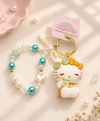 Hello Kitty beaded keychain with blue and pearl beads, star and heart accents, character charm and gold-tone keyring