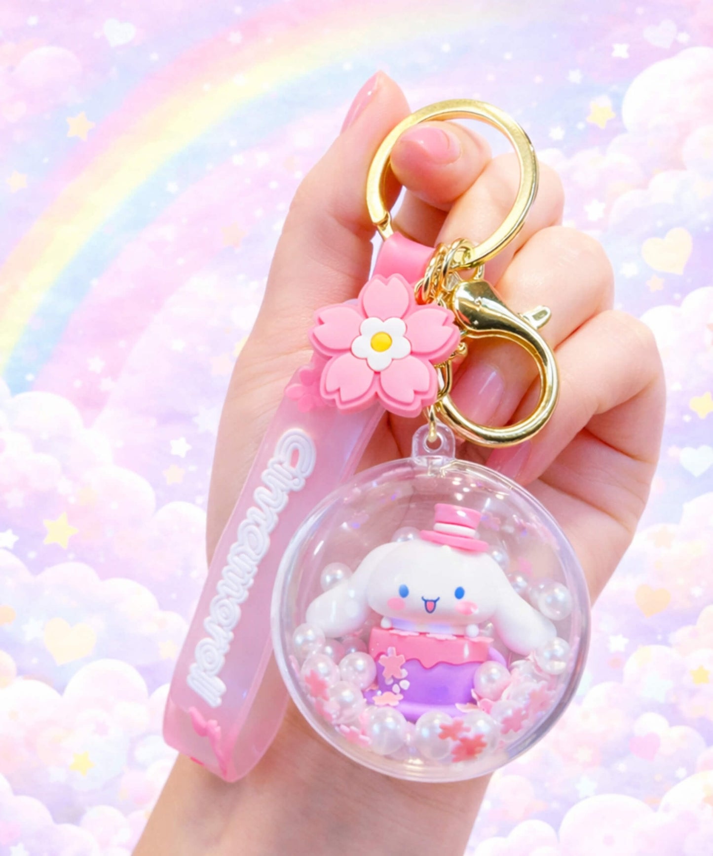 Sanrio Cinnamoroll floating bead shaker keychain close up in hand, cute pastel aesthetic charm with moving pearls inside