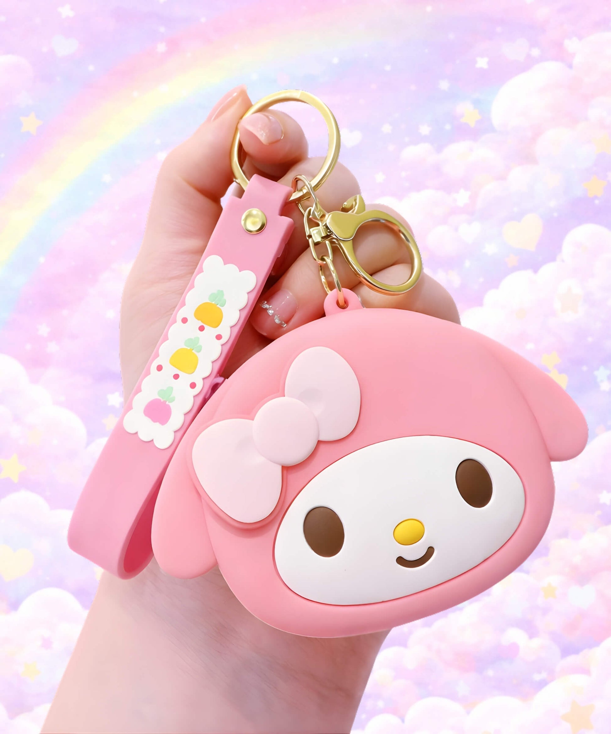 Sanrio silicone coin purse keychain with My Melody pink design held in hand, cute mini pouch bag charm with pastel background