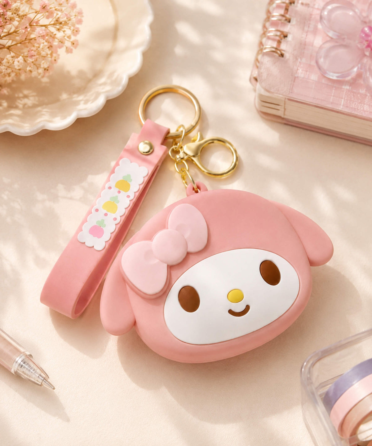 Pink My Melody silicone coin purse keychain with bow detail, wrist strap and gold-tone keyrings